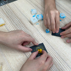 Participants sanding and finishing handmade artisan keycaps at Artzei Studio workshop Singapore