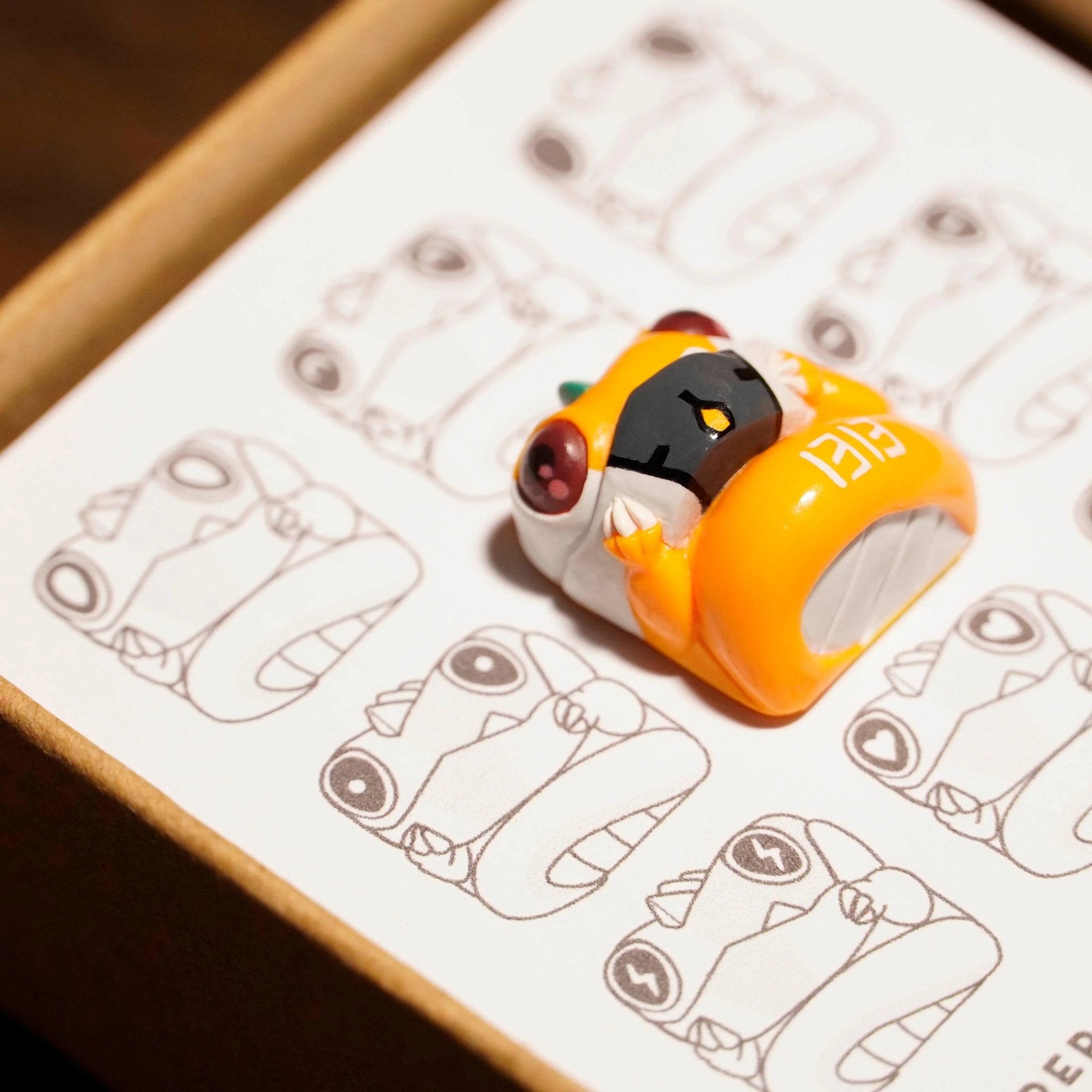 Chomper Evangelion Unit 00 artisan keycap close-up on Chomper sketch illustration card