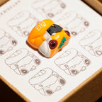 Chomper Evangelion Unit 00 artisan keycap side angle view on Chomper sketch illustration card