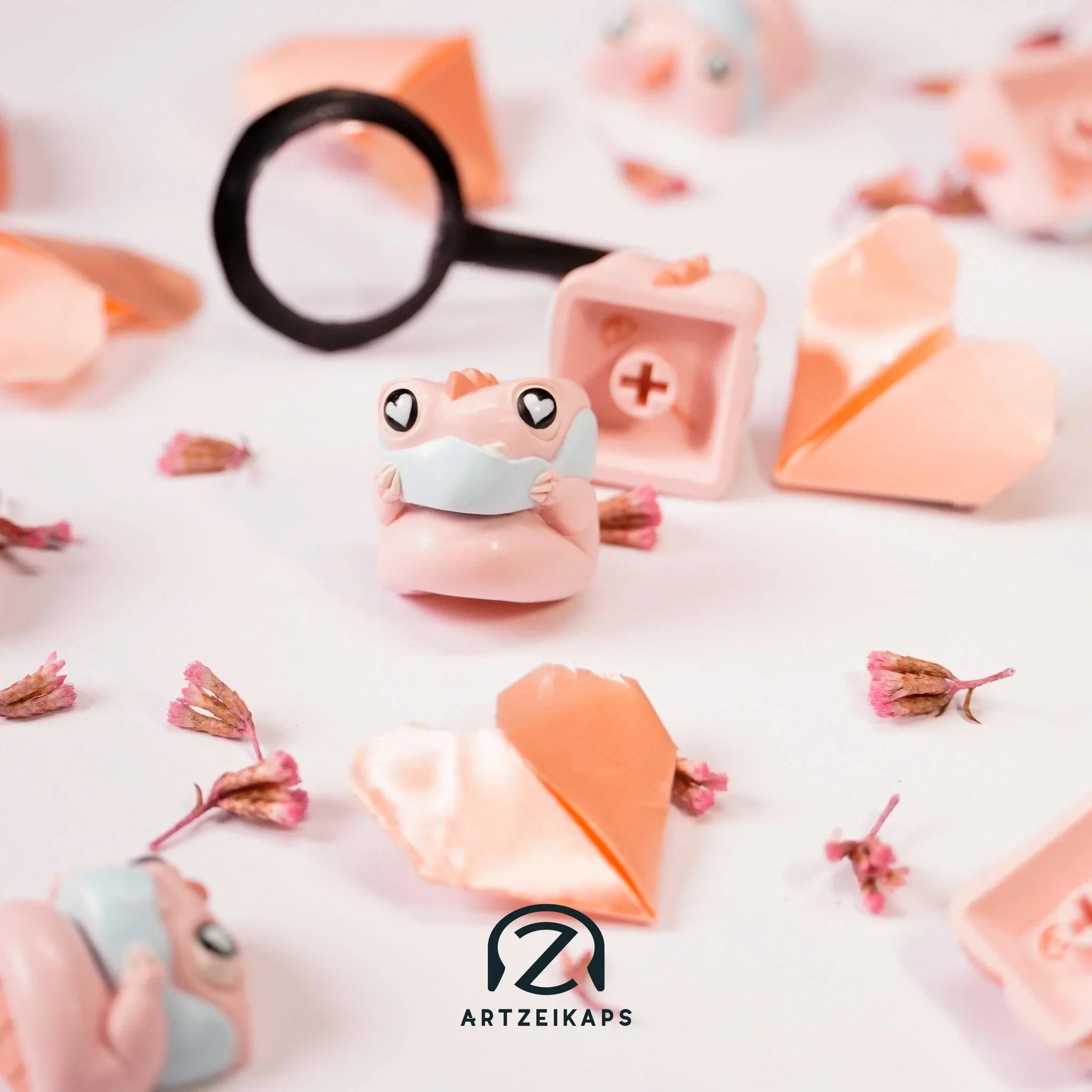 Chomper KBM Love Detective artisan keycap Light version close-up with magnifying glass on white background with origami hearts