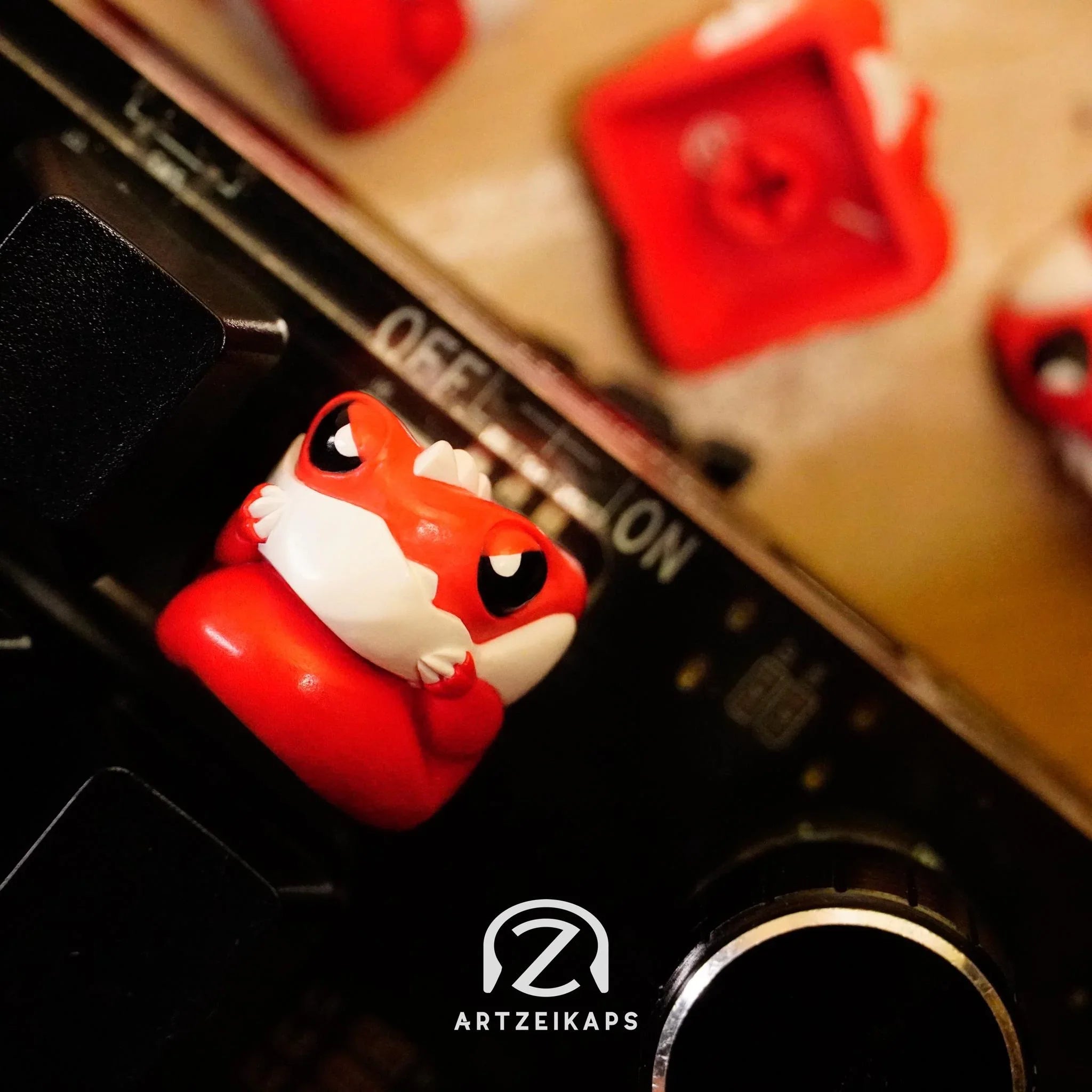 Chomper Lil' Red Grump artisan keycap top-down view on black mechanical keyboard