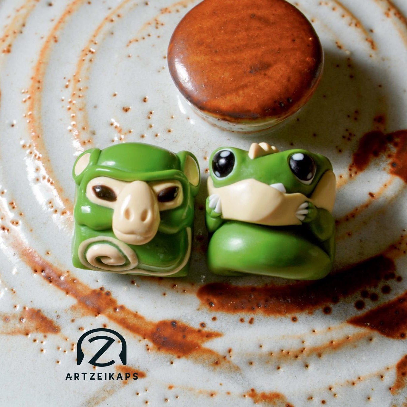 Chomper and Smunkey GMK Cream Matcha artisan keycap close-up front view on rustic ceramic plate