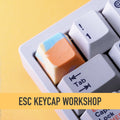 ESC Keycap Workshop — artisan keycaps on a mechanical keyboard with yellow accent