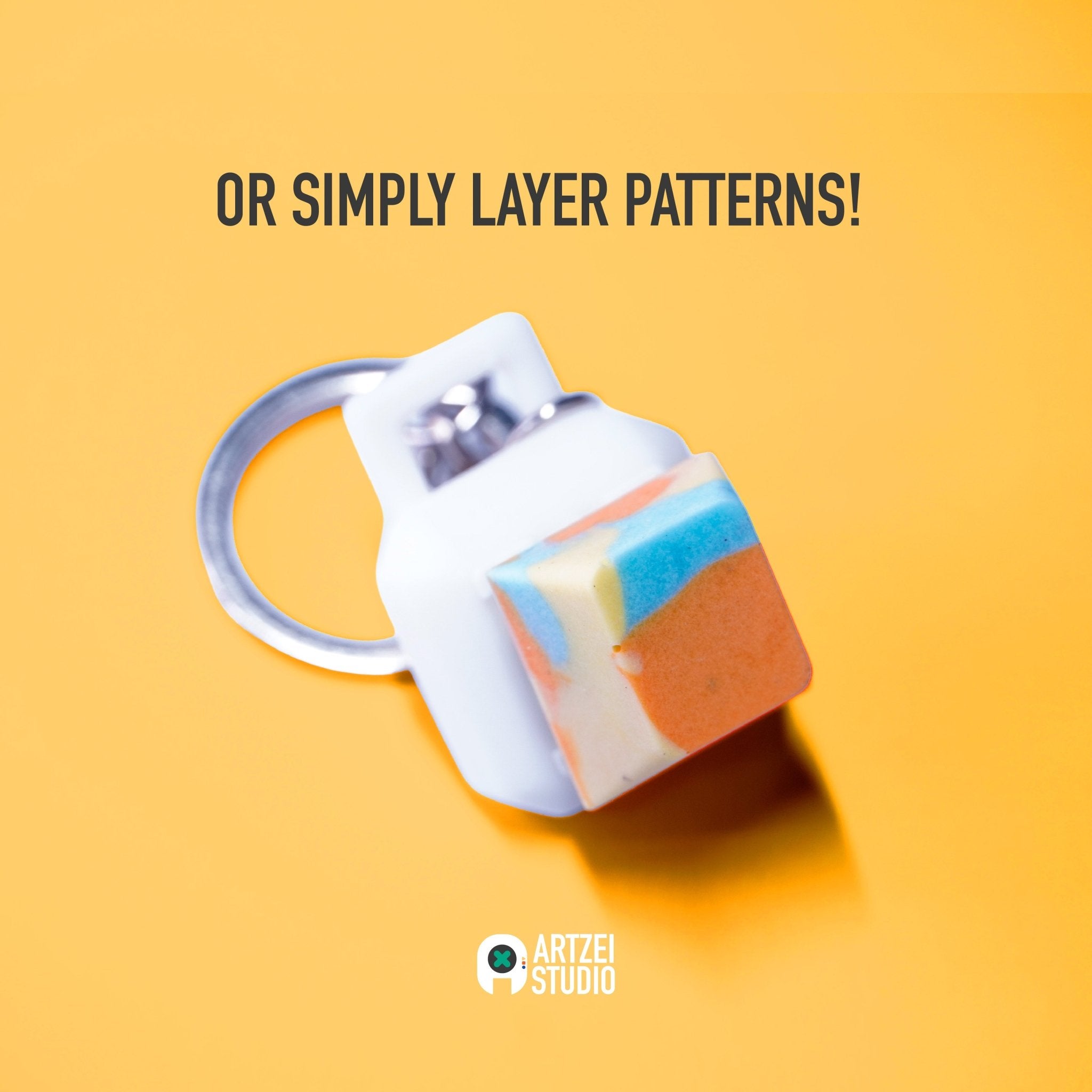 Artisan keycap with layered colour patterns on keychain