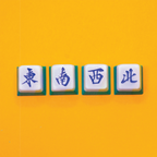 Creative Workshops in Singapore - Mahjong wind tiles artisan keycaps (East, South, West, North) on a bright yellow background. 