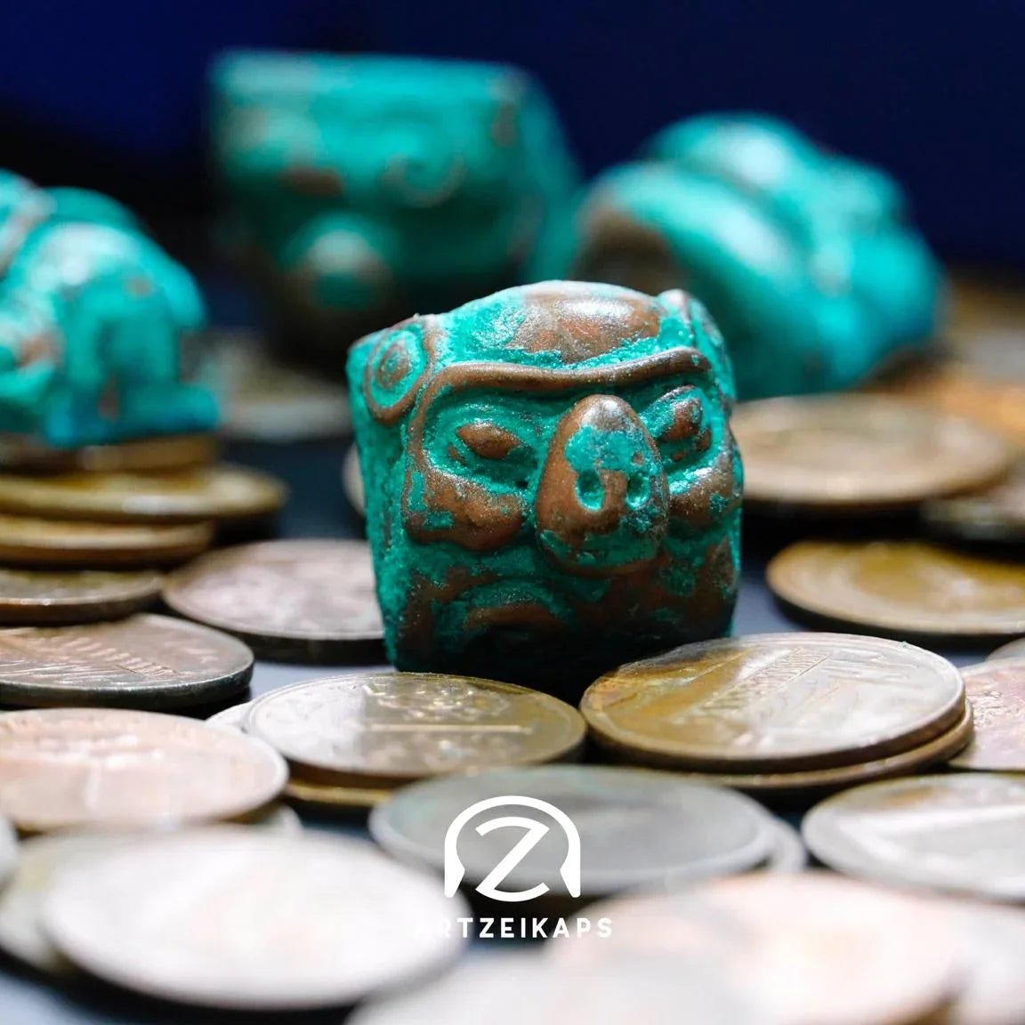 Smunkey artisan keycap in Copper Patina finish surrounded by coins, close-up front view