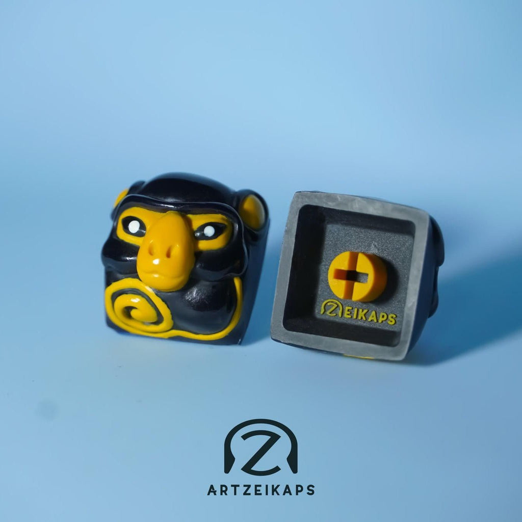 Smunkey Fall '21 artisan keycap in Navy Blue, front and back view on light blue backgroundvy 