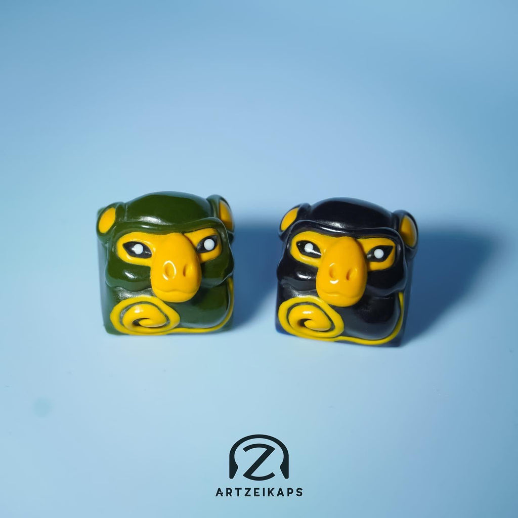 Smunkey Fall '21 artisan keycaps in olive green and navy blue, front view pair on light blue background