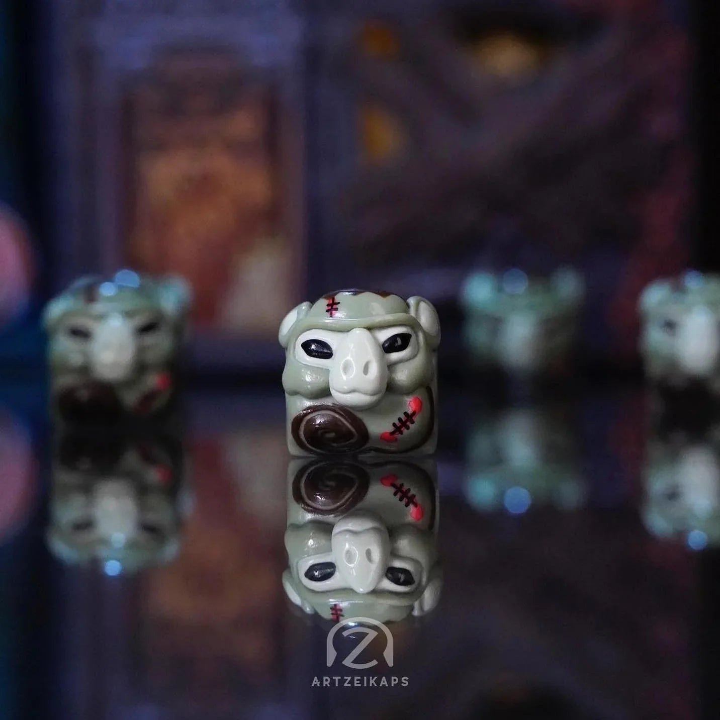 Smunkey FrankenZ artisan keycap in zombie green with red stitch marks, close-up front view with reflection