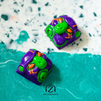 Smunkey GMK M-01 artisan keycap close-up front view on teal terrazzo surface