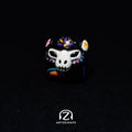 Smunkey GMK Mictlan artisan keycap in black with Day of the Dead skull and floral face paint design, solo front view on dark background