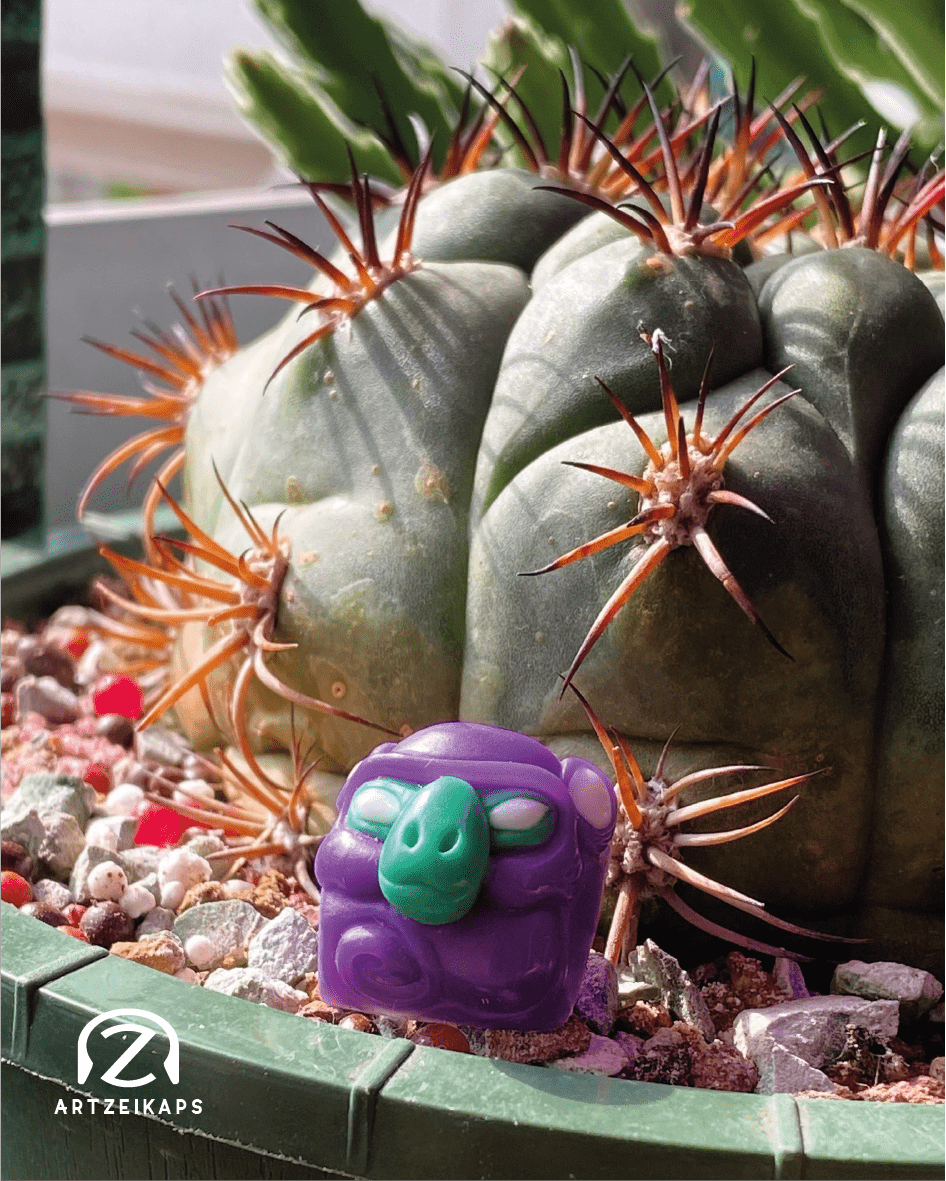 Smunkey OG artisan keycap resin keycap sitting in a cactus pot