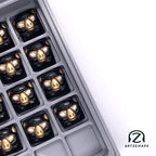 Smunkey artisan keycap Pirate's Gold in an artisan keycap tray